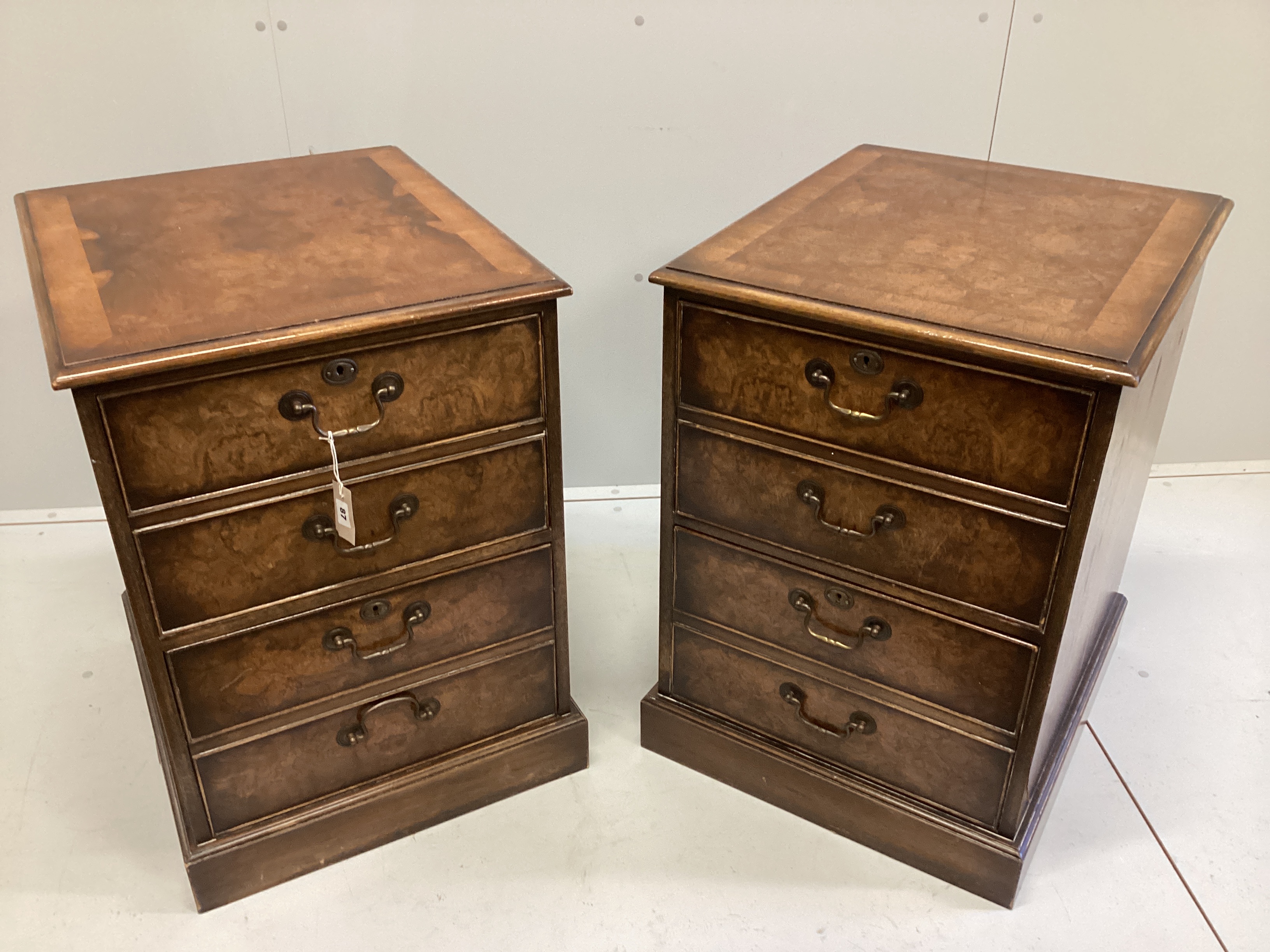 A pair of reproduction George III style banded walnut two drawer filing chests, width 54cm, depth 64cm, height 76cm